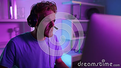 Cyber gamer talking team in headphones closeup. Gaming blogger streaming video Stock Photo