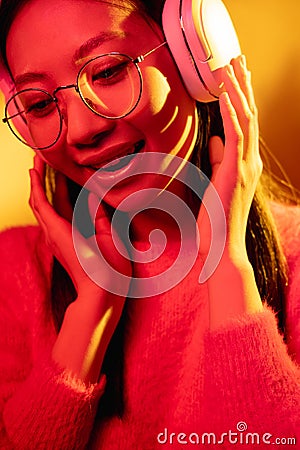 cyber music color light face dj girl in headphones Stock Photo