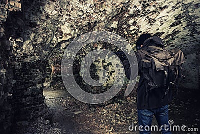 Cyber punk, postapocalyptic world, man in goggles among ruins of city Stock Photo