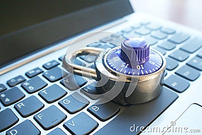 Cyber Security With Blue Number Dial Lock On Laptop Keyoard High Quality Stock Photo