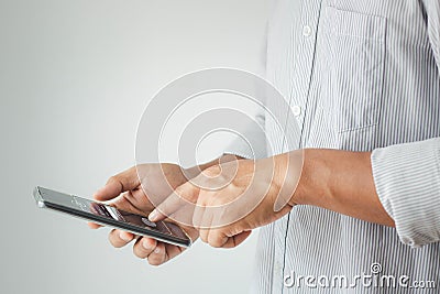 Cyber security internet and networking concept. Businessman hand holding smartphone and login with finger scan Stock Photo