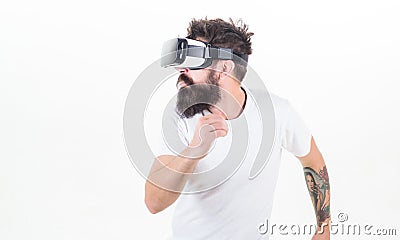 Cyber sport. Guy with head mounted display interact virtual reality. Hipster play virtual sport game. Virtual race. Man Stock Photo