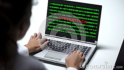 Cyberattack on laptop computer, woman working in big company office, cybercrime Stock Photo