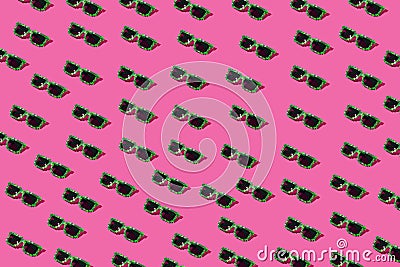 Cyberpunk futuristic neon green sunglasses on pastel pink background. Summer concept. Pattern. Poster design Stock Photo