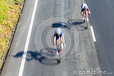 Cyclists Road Race Motion Speed Blur Overhead Stock Photo