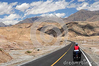 Cycling on Karakorum Highway Stock Photo