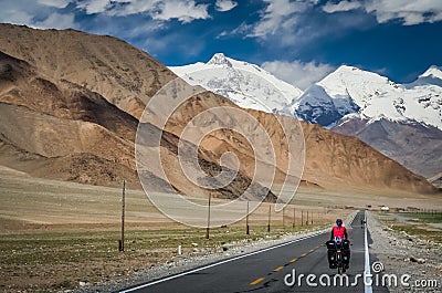 Cycling on Karakorum Highway Stock Photo