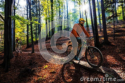 Cycling man riding on bike at sunset. Stock Photo