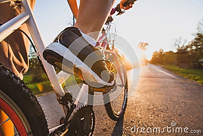 Cycling outdoors, close up of the feet on bicycle Stock Photo