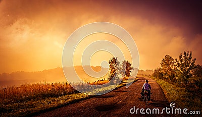 Cycling on the rural roads Stock Photo