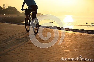 Cycling at sunrise seaside Stock Photo