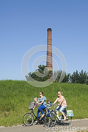 Cycling women with children for the Omringdijk Editorial Stock Photo