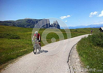 Cyclist in Alpe di Siusi Stock Photo