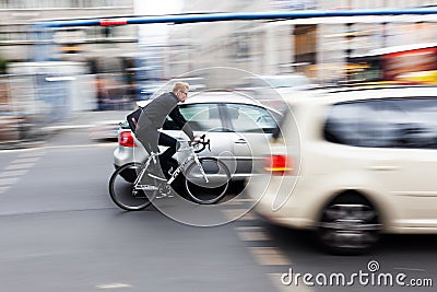 Cyclist in Berlin, Germany, in motion blur Editorial Stock Photo