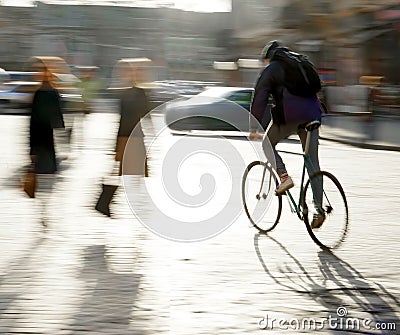 Cyclist on the city roadway Stock Photo