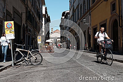 A despatch rider cyclist in Florence, Italy Editorial Stock Photo