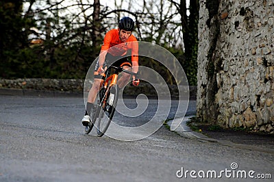 Cyclist downhill in the rain. Editorial Stock Photo