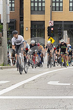 Cyclist leads group ascending hill at tosa village classic Editorial Stock Photo