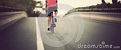 Cyclist legs riding bike Stock Photo