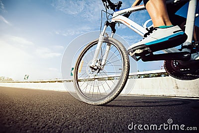 Cyclist legs riding Mountain Bike Stock Photo