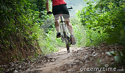 Cyclist legs riding Mountain Bike Stock Photo