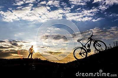 Cyclist man silhouette and mountain bike Stock Photo