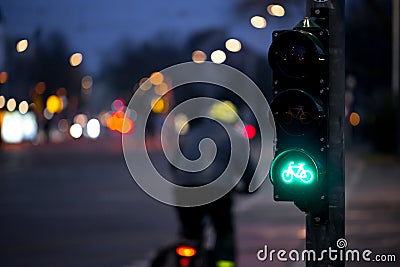 Cyclist passes bicycle traffic light Stock Photo