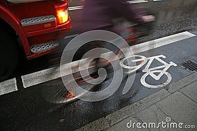 Cyclist in rain Stock Photo