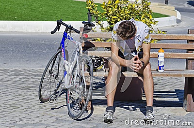 A cyclist resting Editorial Stock Photo