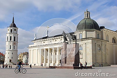 Cyclist Cathedral Basilica and Bell Tower, Vilnius, Lithuania Editorial Stock Photo