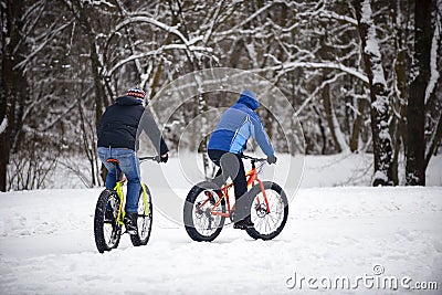Cyclist in winter on a bicycle with very wide wheels 2018 Stock Photo