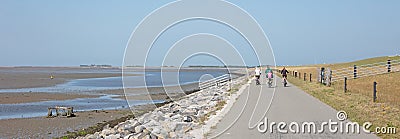 Cyclists cycling on a dyke Editorial Stock Photo
