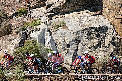 Cyclists cycling in a peleton on Chapmans Peak Drive, Cape Town, South Africa. They are preparing for the Argus race. Editorial Stock Photo