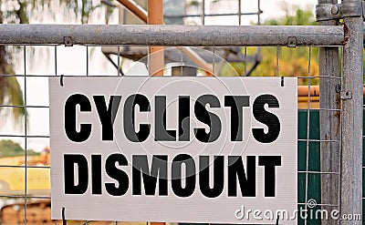 Cyclists Dismount Sign Stock Photo