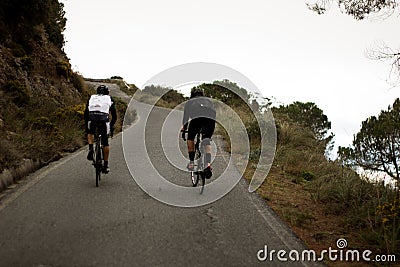 Cyclists going up a slope Editorial Stock Photo
