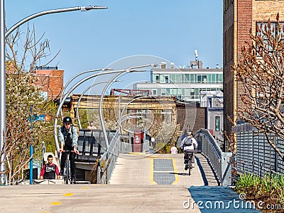 Cyclists and Pedestrians using The 606 Bloomingdale Trail in Bucktown. Streets of Chicago Editorial Stock Photo
