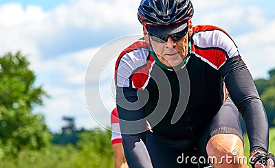 Cyclists racing on country roads Stock Photo