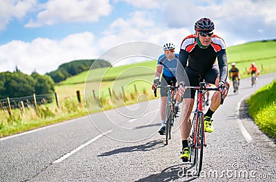 Cyclists racing on country roads Stock Photo