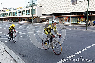 Cyclists riding bicycles on street Editorial Stock Photo