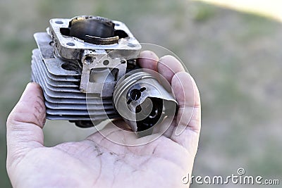 Cylinder and piston from internal combustion engine engine in hand Stock Photo