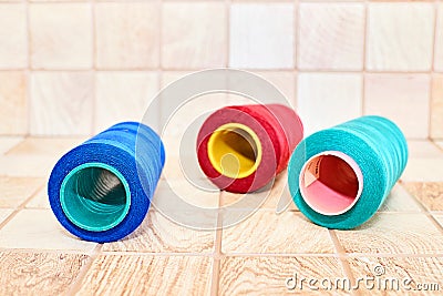 Three spools of thread. Navy, red and blue Stock Photo