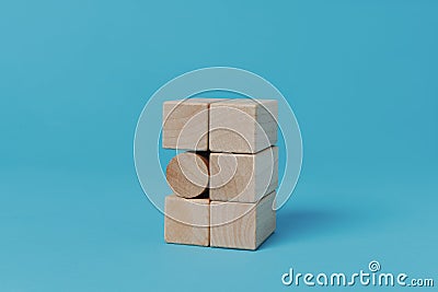 cylindrical toy block between square toy blocks Stock Photo