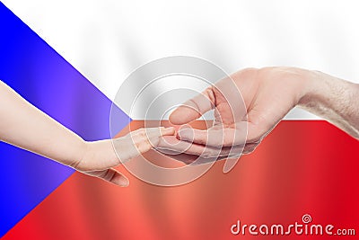 Czech baby and parent hands on the background of flag of Czech Republic Help, aid, support, charity concept Stock Photo