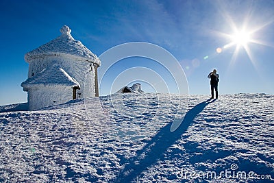 St. Lawrence`s Chapel on Snezka peak. Snowy winter countryside, Snezka mount - Ruzova hora, Krkonose Giant mountains, Czech repu Editorial Stock Photo