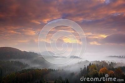 Czech typical autumn landscape. Hills and forest with foggy morning. Morning fall valley of Bohemian Switzerland park. Hills with Stock Photo