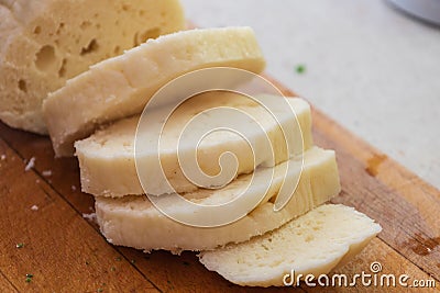 Czech yeast dumpling sliced into wheels and put into a steaming pot to keep the dumpling hot Stock Photo