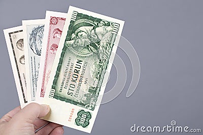 Czechoslovak Crowns in the hand on a gray background Stock Photo