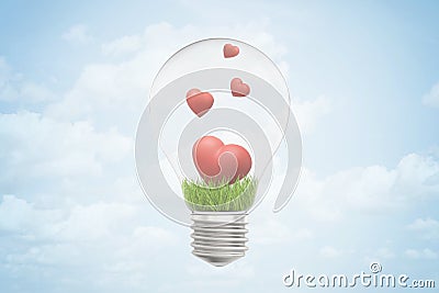 3d closeup rendering of lightbulb and green grass and four cute red hearts inside it, against blue sky with clouds. Stock Photo