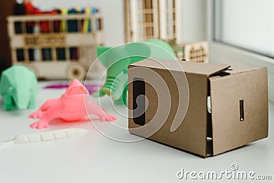 Virtual cardboard reality glasses for children and 3D figures. Stock Photo