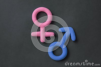 3d gender symbol pink and blue icon on black background. Concept of equality of man and woman,.differences between the sexes, Stock Photo